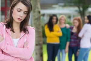 girl being bullied by a female group