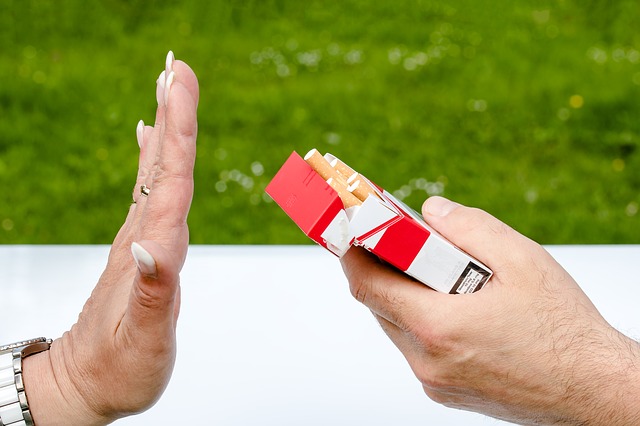 A woman refusing a cigarette