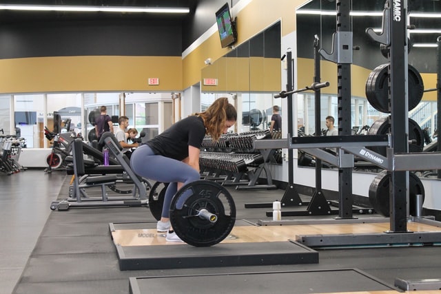 A woman deadlifting