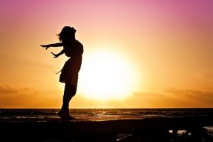 Woman enjoying the sunset.