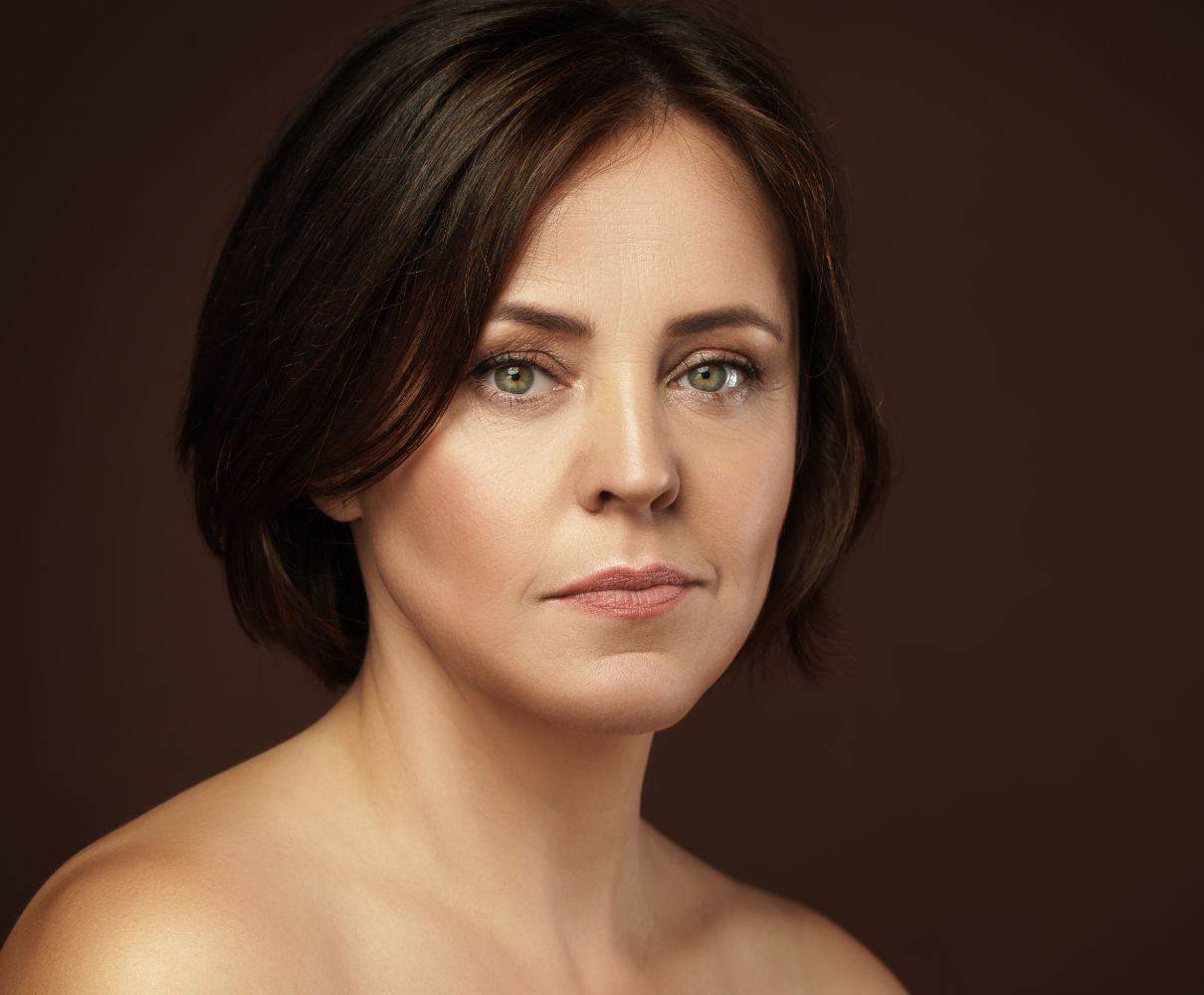 Mature woman with short brown hair